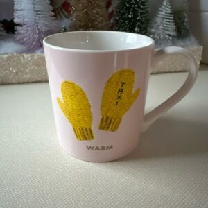 Light pink Kate Spade coffee mug.